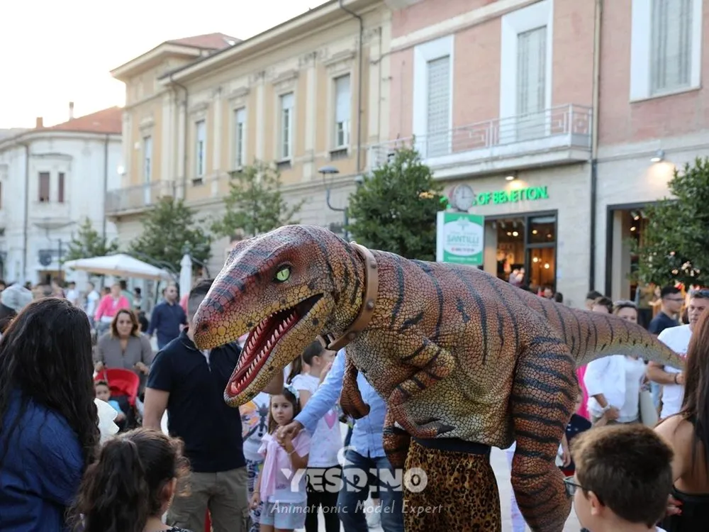 People having fun and playing with velociraptor costume.webp