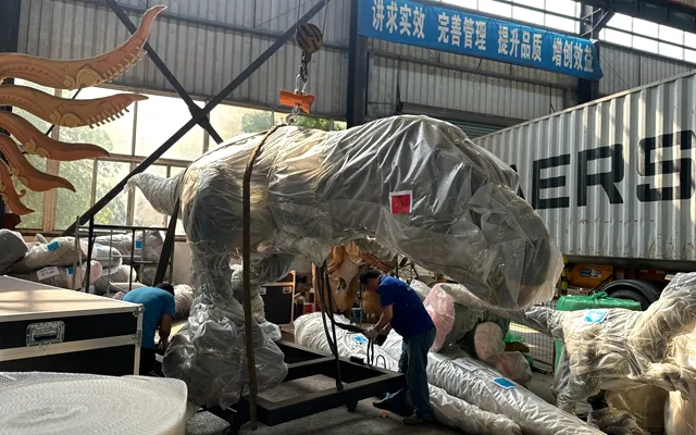 Step 8: packing an animatronic dinosaur in foam-lined crates for sea shipping